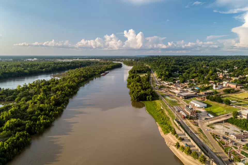A diversion canal from the Yazoo River is shown from above. The river's banks are lined with industrial land uses near the city of Vicksburg, Mississippi.